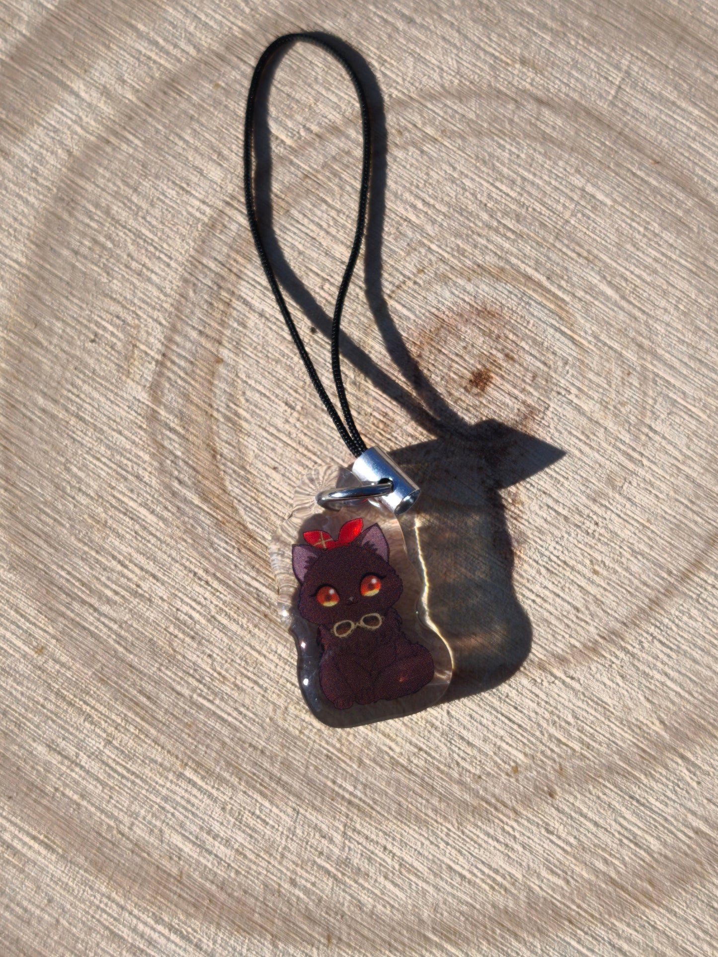 Bijou de téléphone / sac Amber